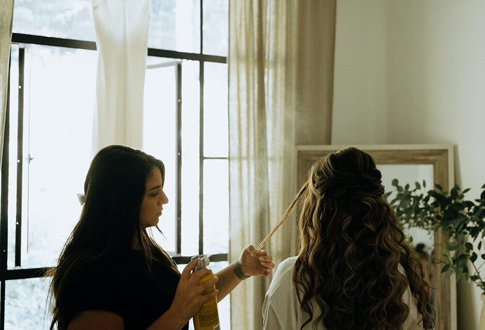 Kristen Marie styling a bride